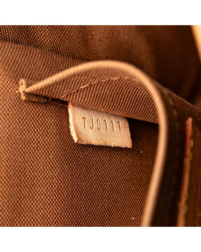 Monogram Canvas Crossbody Bag with Adjustable Strap and Buckle Closure