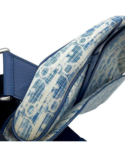 Kasuri Oblique Canvas Saddle Crossbody with Adjustable Strap and Magnetic Snap Closure