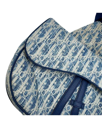 Kasuri Oblique Canvas Saddle Crossbody with Adjustable Strap and Magnetic Snap Closure