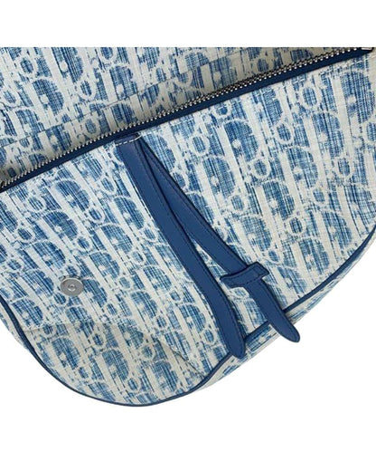Kasuri Oblique Canvas Saddle Crossbody with Adjustable Strap and Magnetic Snap Closure
