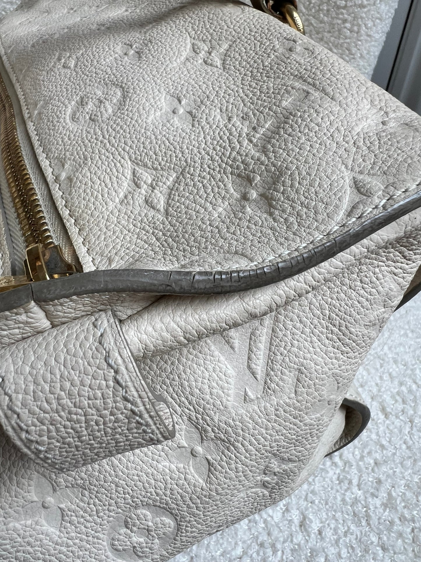 Louis Vuitton Inspiree in Cream Empreinte Leather with gold hardware