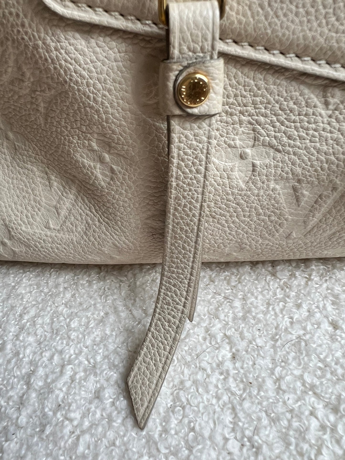 Louis Vuitton Inspiree in Cream Empreinte Leather with gold hardware