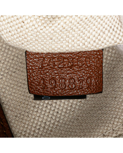 Small Leather Crossbody Bag with Tassel Detail