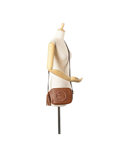 Small Leather Crossbody Bag with Tassel Detail