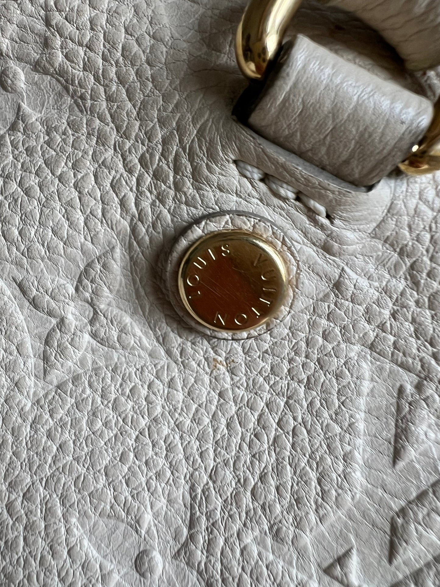 Louis Vuitton Inspiree in Cream Empreinte Leather with gold hardware