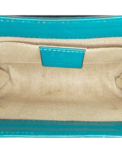Mini Embossed Leather Crossbody with Chain Strap and Tassel Detail