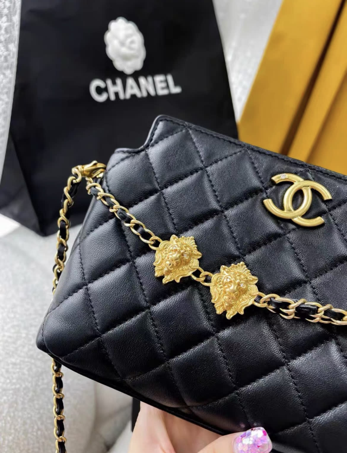 Chanel 23A Black And Gold Lion Emblem Chain Bag