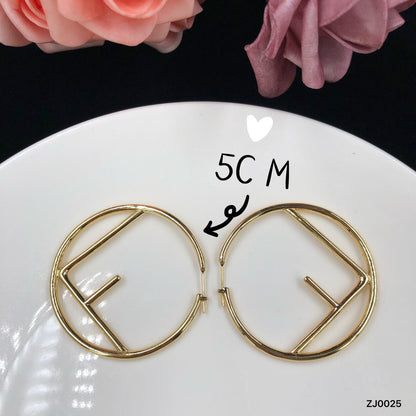 F gold earrings